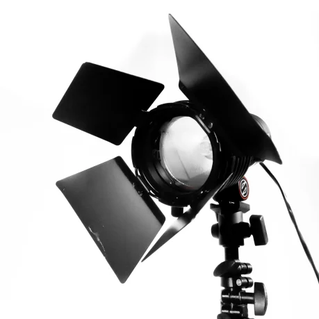 A Sachtler Lighting photo light with tripod on a white background.